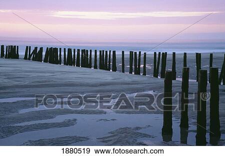 Stock Photo - Seascape At Dusk With Pillars In Foreground, Biarritz. Fotosearch