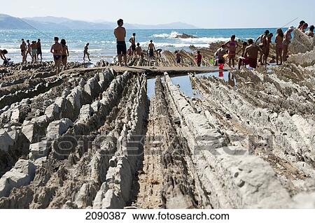Sedimentary Rocks Known As Flysch At Itzurun Beach, Zumaia, Basque Country, Spain View Large Photo Image Stock Photo - Sedimentary Rocks Known As Flysch At Itzurun Beach, Zumaia, Basque Country, Spain. Fotosearch