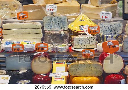 Stock Photo - Selection Of Cheese In Shop Window; Madrid Spain. Fotosearch