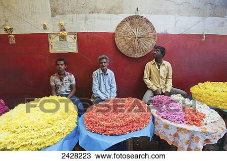 Stock Image - Selling colourful items on tables; Mysore, India. Fotosearch