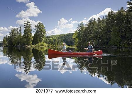 Senior Couple Canoeing On Smoke Lake, Algonquin Park, Ontario View Large Photo Image Stock Photo - Senior Couple Canoeing On Smoke Lake, Algonquin Park, Ontario. Fotosearch