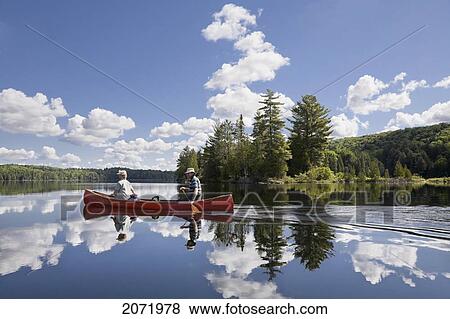 Senior Couple Canoeing On Smoke Lake, Algonquin Park, Ontario View Large Photo Image Stock Photo - Senior Couple Canoeing On Smoke Lake, Algonquin Park, Ontario. Fotosearch