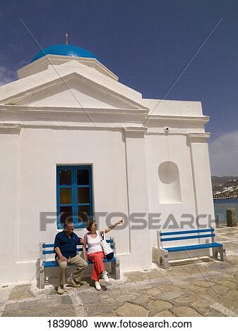 Senior Couple Sitting Outside Orthodox Church; Mykonos, Greece View Large Photo Image Stock Image - Senior Couple Sitting Outside Orthodox Church; Mykonos, Greece. Fotosearch