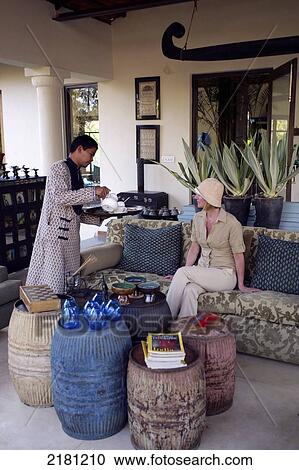 Serving tea in the lobby of Baghvan Wilderness Lodge, Pench National Park; Madhya Pradesh, India View Large Photo Image Stock Image - Serving tea in the lobby of Baghvan Wilderness Lodge, Pench National Park; Madhya Pradesh, India. Fotosearch