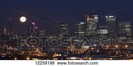 Setting full moon over Canary Wharf; London, England View Large Photo Image Stock Photo - Setting full moon over Canary Wharf; London, England. Fotosearch