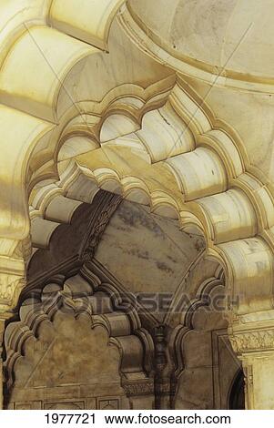 Stock Image - Several Scalloped Archways; India, Close up detail of temple architecture. Fotosearch
