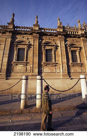 Stock Image - Seville, Spain. People Walking By Cathedral Gilrada. Fotosearch