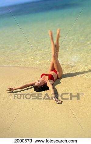 Sexy Woman In Red Bikini On Beach, In Shoreline Water, Legs Crossed In Air, Clear Water View Large Photo Image Stock Image - Sexy Woman In Red Bikini On Beach, In Shoreline Water, Legs Crossed In Air, Clear Water. Fotosearch