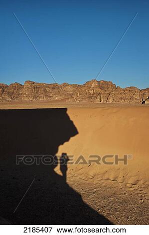 Stock Photo - Shadow Of A Person On Desert, Wadi Rum, Jordan, Middle East. Fotosearch