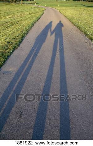 Shadow Of Couple Holding Hands In Park View Large Photo Image Stock Image - Shadow Of Couple Holding Hands In Park. Fotosearch
