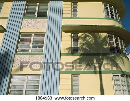 Stock Image - Shadow Of Palm Tree On Art Deco Building. Fotosearch