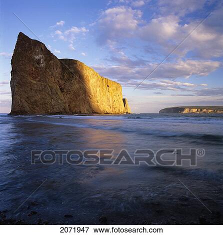 Stock Photo - Shadow On Perce Rock, Gaspe Peninsula, Quebec. Fotosearch