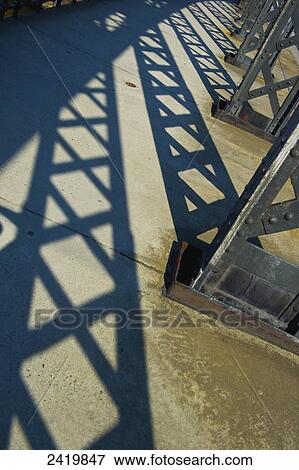 Stock Photo - Shadows of steel beams on the pavement; Hamburg, Germany. Fotosearch