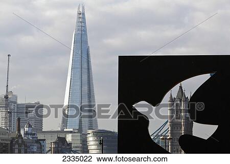 Stock Image - Shard And Tower Bridge Viewed Through Public Art; London, England, Uk. Fotosearch