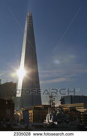 Stock Photo - Shard With Sunburst And Hms Belfast; London, England, Uk. Fotosearch