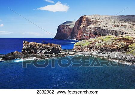 Stock Image - Shark's Fin Rock and Southern coastline; Lanai, Hawaii, United States of America. Fotosearch