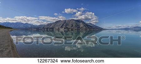 Picture - Sheep mountain reflected in the clear waters of Kuane Lake; Yukon, Canada. Fotosearch