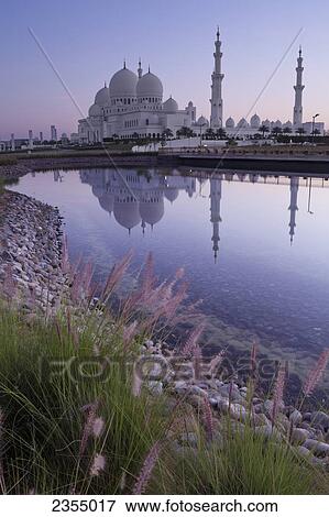 Stock Photo - Sheikh Zayed Grand Mosque at sunrise; Abu Dhabi, United Arab Emirates. Fotosearch