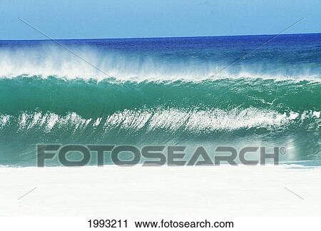 Shimmery Shorebreak Wave With Silver Waters In Foreground. View Large Photo Image Stock Image - Shimmery Shorebreak Wave With Silver Waters In Foreground.. Fotosearch