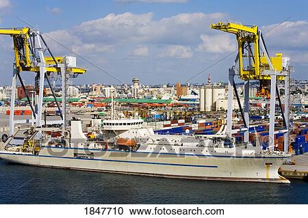 Ship Being Loaded In Container Port; Naha, Okinawa-Honto, Japan View Large Photo Image Stock Image - Ship Being Loaded In Container Port; Naha, Okinawa-Honto, Japan. Fotosearch