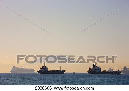 Stock Photograph - Ships Anchored In Algeciras Bay With Jebel Musa Mountain (Morocco) In The Background; Cadiz Province Spain. Fotosearch