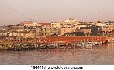 Stock Image - Ships In Docks At Sunset; Naples, Italy. Fotosearch