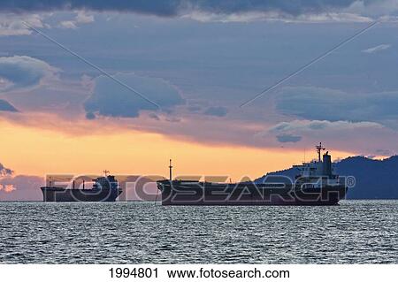 Stock Image - Ships In English Bay At Dusk, Vancouver, British Columbia, Canada. Fotosearch