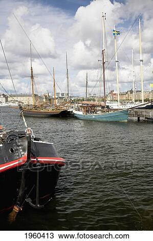 Stock Image - Ships Moored In The Waterway At Skeppsholmen; Stockholm, Sweden. Fotosearch