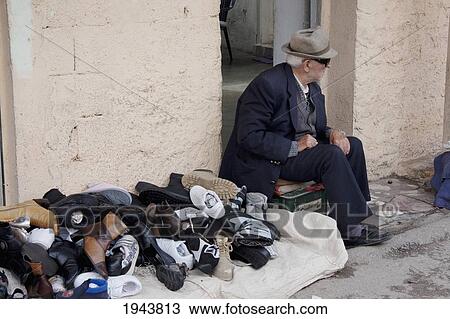Stock Image - Shoe Vendor At The Market, Tirana, Albania. Fotosearch