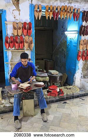 Stock Photo - Shoemaker At Market In Old Town Medina Area; Kairouan, Tunisia, North Africa. Fotosearch