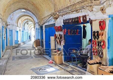 Shoemaker At Market In Old Town Medina Area; Kairouan, Tunisia, North Africa View Large Photo Image Stock Photograph - Shoemaker At Market In Old Town Medina Area; Kairouan, Tunisia, North Africa. Fotosearch