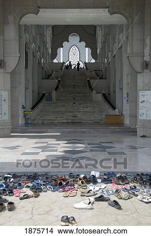 Shoes Left Outside The Doorway Of A Building; Kuala Lumpur, Malaysia View Large Photo Image Picture - Shoes Left Outside The Doorway Of A Building; Kuala Lumpur, Malaysia. Fotosearch