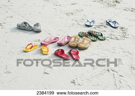 Shoes on the beach; Koh Samet Island, Thailand View Large Photo Image Stock Photo - Shoes on the beach; Koh Samet Island, Thailand. Fotosearch