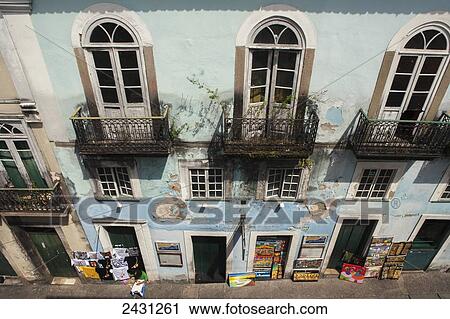 Shopkeepers and craftsmen display paintings and t-shirts in the doorways of old colonial buildings in the historical centre of Salvador; Salvador, Brazil View Large Photo Image Stock Image - Shopkeepers and craftsmen display paintings and t-shirts in the doorways of old colonial buildings in the historical centre of Salvador; Salvador, Brazil. Fotosearch