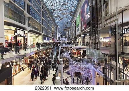 Stock Image - Shopping At The Eaton Centre Shopping Mall; Toronto Ontario Canada. Fotosearch