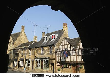 Shops Along High Street Framed By Famous 17Th Century Market Hall View Large Photo Image Stock Photo - Shops Along High Street Framed By Famous 17Th Century Market Hall. Fotosearch