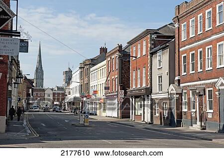 Stock Image - Shops And Pedestrians Along A Street; Salisbury England. Fotosearch