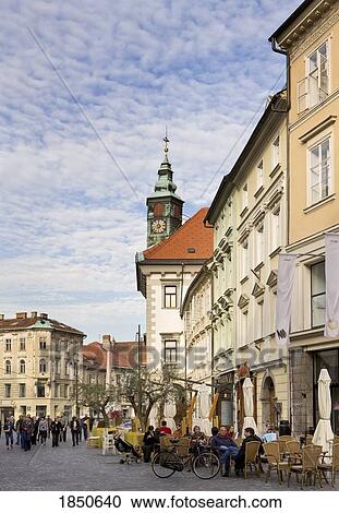 Stock Image - Shot Of Outdoor Cafe On Busy Street. Fotosearch