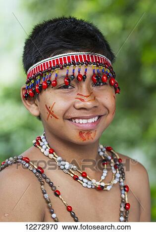 Stock Image - Shuar boy wearing traditional dress, Limon, Guayas, Ecuador. Fotosearch