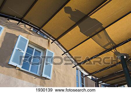 Stock Photo - Shuttered window on an apartment in the Terra Nova, or the Citadel district of Bastia; Bastia, Corsica, France. Fotosearch