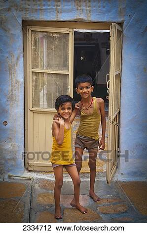 Sibling Posing In Front Of Weathered Door; Jaisalmer,, India View Large Photo Image Stock Image - Sibling Posing In Front Of Weathered Door; Jaisalmer,, India. Fotosearch
