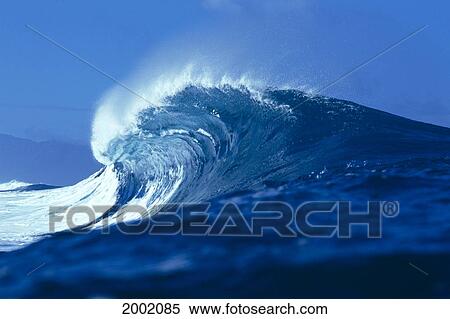 Side Angled View Of Big Blue Wave Curling With Spray, Blue Skies In Background View Large Photo Image Stock Photography - Side Angled View Of Big Blue Wave Curling With Spray, Blue Skies In Background. Fotosearch