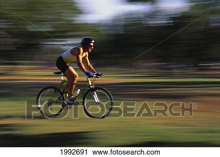 Side Angled View Of Sport Biker On Mountain Bike, Blur Action View Large Photo Image Stock Image - Side Angled View Of Sport Biker On Mountain Bike, Blur Action. Fotosearch