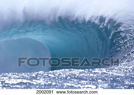 Stock Image - Side View Of Giant Tube With Spray, Water Reflections Foreground. Fotosearch