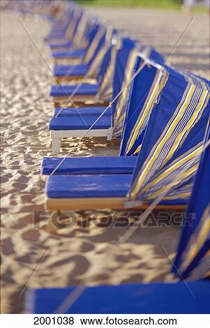 Side View Rows Beach Chairs Cabana, Blue Yellow Striped, Afternoon Light Soft Focus View Large Photo Image Stock Photo - Side View Rows Beach Chairs Cabana, Blue Yellow Striped, Afternoon Light Soft Focus. Fotosearch