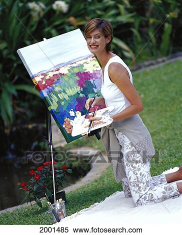 Side View Smiling Woman Outdoor Painting On Canvas, Green Blurry Background Tropical View Large Photo Image Stock Photography - Side View Smiling Woman Outdoor Painting On Canvas, Green Blurry Background Tropical. Fotosearch