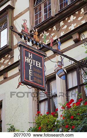 Sign For A Hotel Hanging From The Side Of A Building; Rothenburg Ob Der Tauber Bavaria Germany View Large Photo Image Stock Image - Sign For A Hotel Hanging From The Side Of A Building; Rothenburg Ob Der Tauber Bavaria Germany. Fotosearch