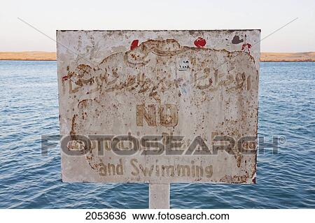 Sign Forbidding Photography And Swimming In The Suez Canal, Suez, South Sinai, Egypt View Large Photo Image Stock Photograph - Sign Forbidding Photography And Swimming In The Suez Canal, Suez, South Sinai, Egypt. Fotosearch