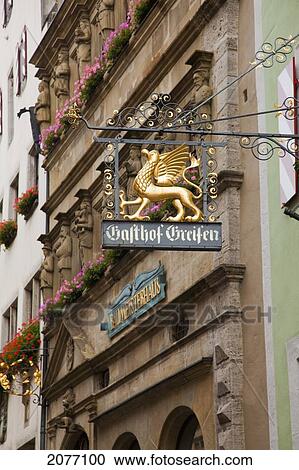 Sign Hanging From A Building With Blossoming Flowers In Window Planter Boxes; Rothenburg Ob Der Tauber Bavaria Germany View Large Photo Image Stock Image - Sign Hanging From A Building With Blossoming Flowers In Window Planter Boxes; Rothenburg Ob Der Tauber Bavaria Germany. Fotosearch