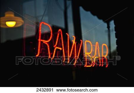 Stock Image - Sign in window of A. W. Shucks oyster restaurant; Charleston, South Carolina, United States of America. Fotosearch